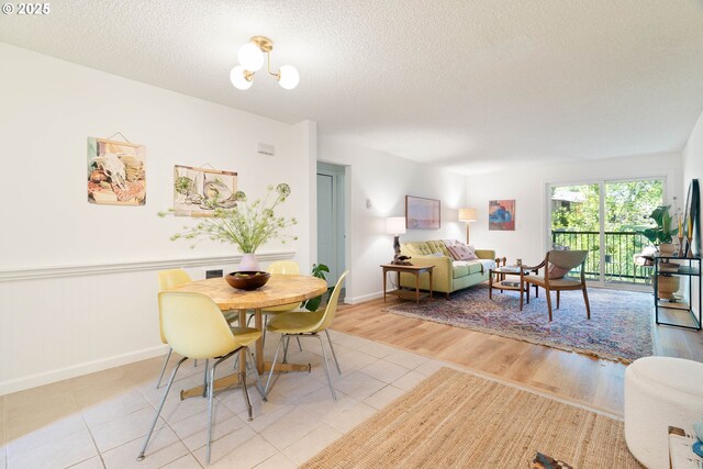 12620 NW Barnes Rd, Portland, OR 97229 - dining area with a textured ceiling and light tile patterned floors