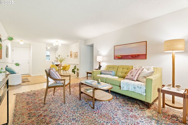 12620 NW Barnes Rd, Portland, OR 97229 - living room with wood finished floors and a textured ceiling