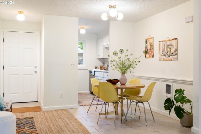 12620 NW Barnes Rd, Portland, OR 97229 - dining area with light tile patterned floors and a textured ceiling