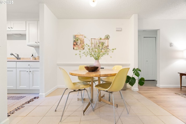 12620 NW Barnes Rd, Portland, OR 97229 - dining room with light tile patterned floors and a textured ceiling