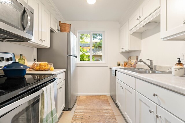 12620 NW Barnes Rd, Portland, OR 97229 - kitchen featuring appliances with stainless steel finishes, light countertops, light tile patterned floors, and white cabinetry