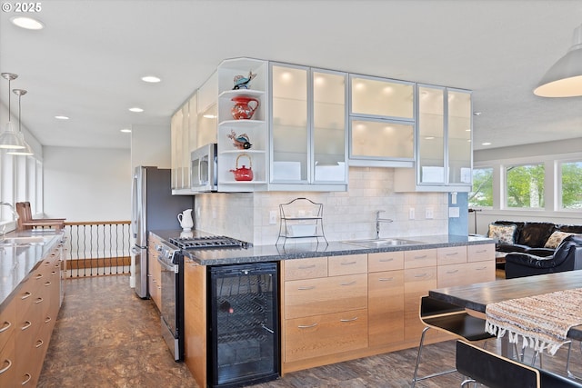 2941 NE Loop Dr, Otis, OR 97368 - kitchen with a sink, beverage cooler, modern cabinets, appliances with stainless steel finishes, and recessed lighting