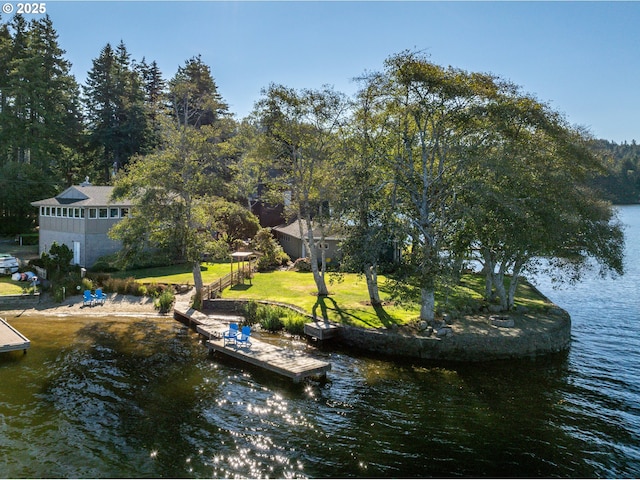 2941 NE Loop Dr, Otis, OR 97368 - dock featuring a water view and a yard