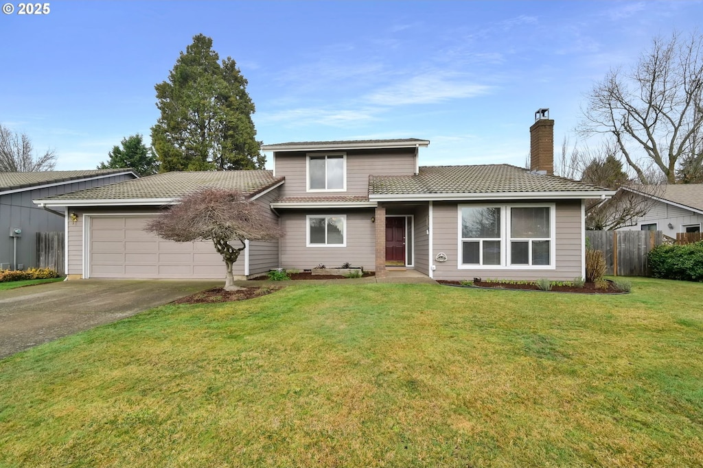 view of front facade featuring a front lawn and a garage