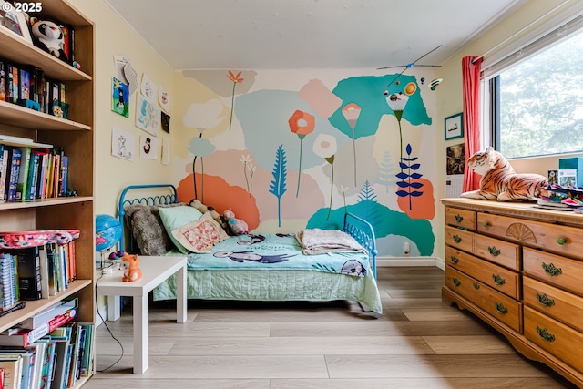 bedroom featuring wood finished floors