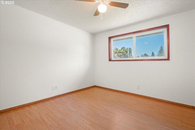 1209 NW 53rd St, Vancouver, WA 98663 - empty room featuring light wood-style floors, a textured ceiling, a ceiling fan, and baseboards