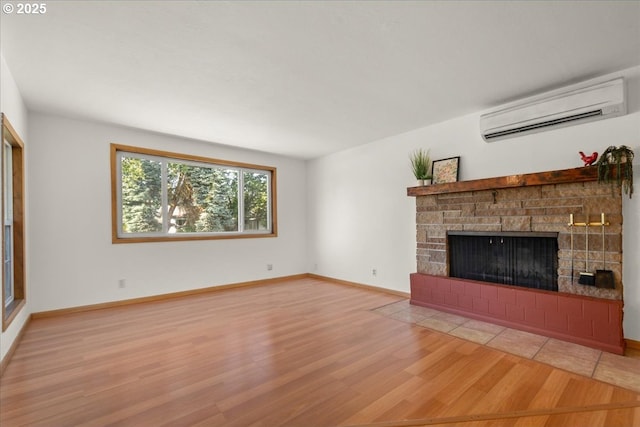 1209 NW 53rd St, Vancouver, WA 98663 - unfurnished living room with a wall mounted AC, wood finished floors, a fireplace, and baseboards
