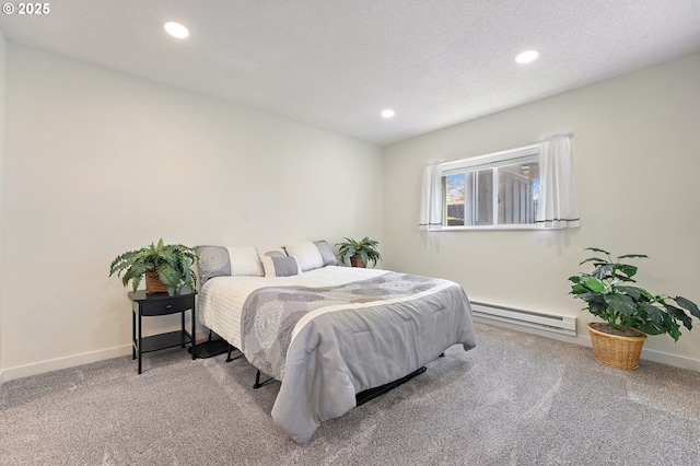 bedroom featuring a baseboard radiator, carpet, and a textured ceiling