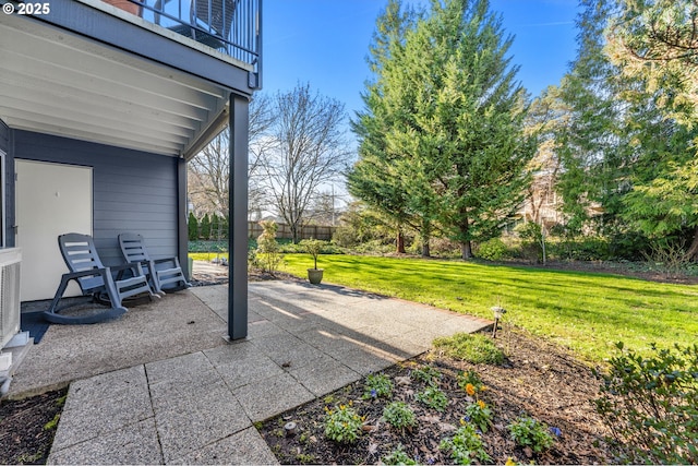 view of patio featuring a balcony