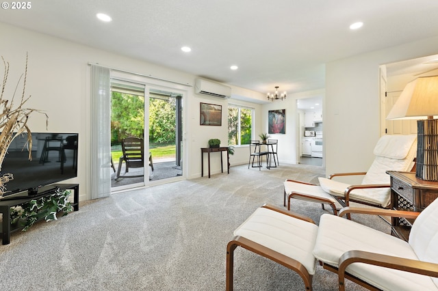 living room with an inviting chandelier, light colored carpet, and a wall unit AC