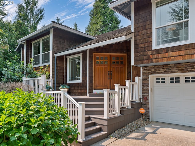 doorway to property featuring a garage