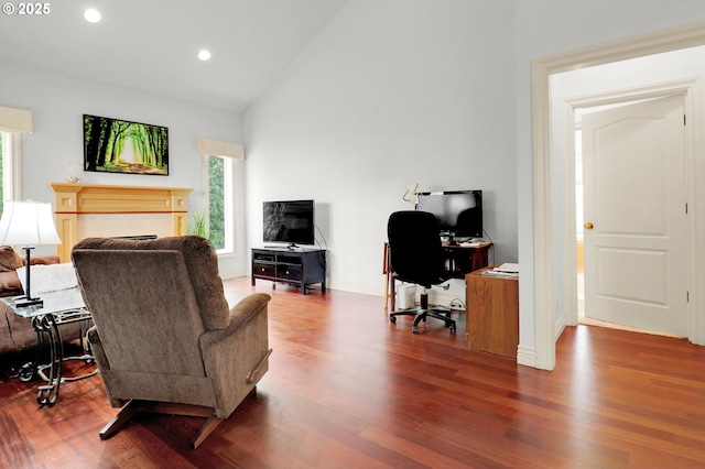 office area featuring recessed lighting, baseboards, wood finished floors, and high vaulted ceiling
