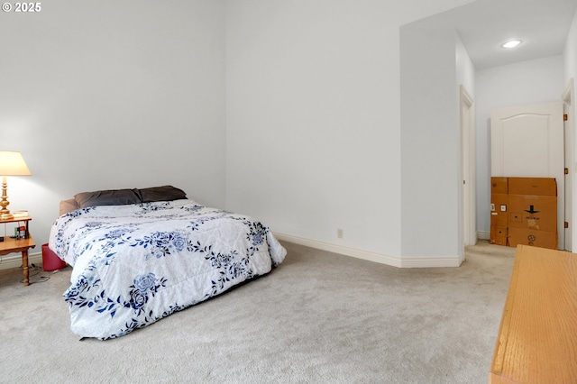 bedroom featuring carpet flooring and baseboards