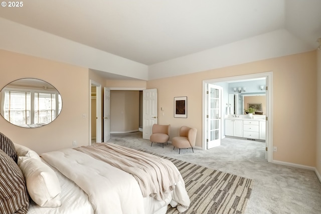 14606 NW Applegate Ln, Portland, OR 97229 - bedroom with baseboards, connected bathroom, and light colored carpet