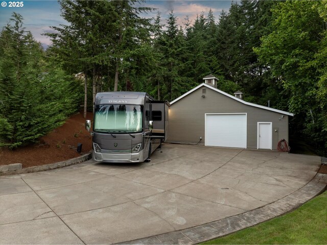 28800 SW Wildhaven Ln, Hillsboro, OR 97123 - garage at dusk with a detached garage and driveway