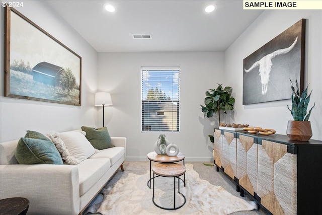 living room featuring light carpet