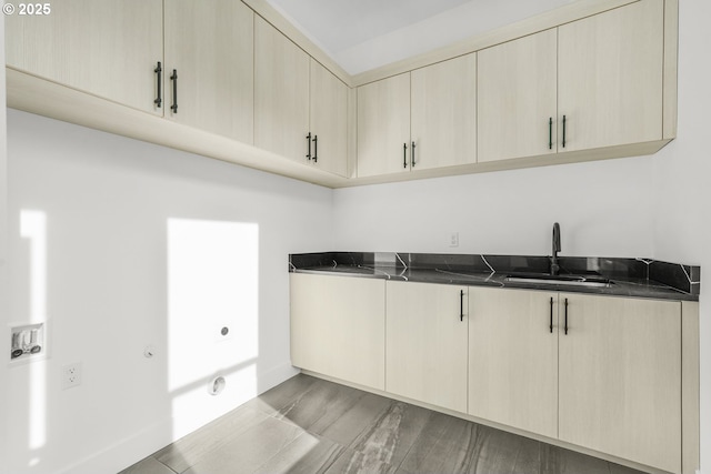 kitchen featuring sink and cream cabinets