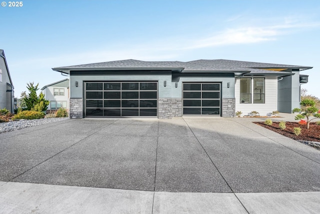 prairie-style home featuring a garage