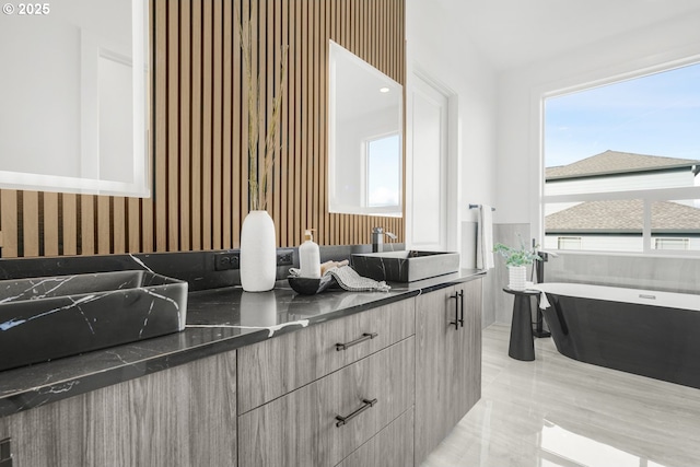 bathroom featuring vanity and a bathtub