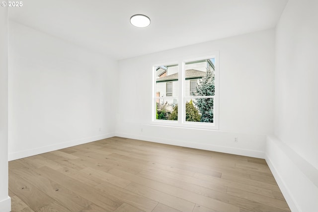 spare room featuring light wood-type flooring