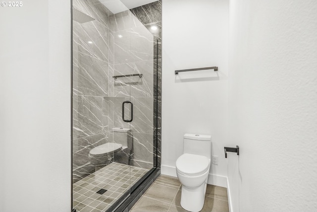 bathroom with a shower with door and toilet