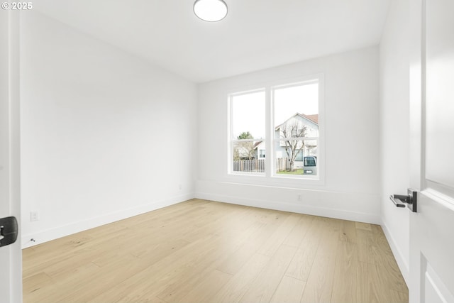 spare room featuring light hardwood / wood-style flooring