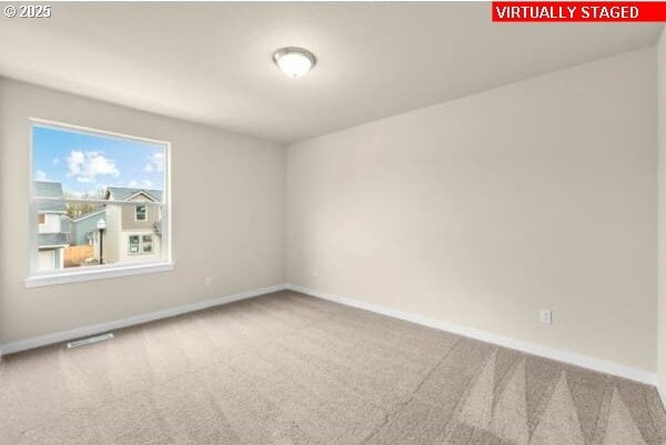 10587 SE Webelos Way, Happy Valley, OR 97086 - carpeted spare room featuring baseboards