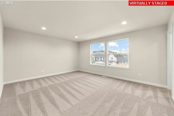 10587 SE Webelos Way, Happy Valley, OR 97086 - unfurnished room featuring carpet and recessed lighting