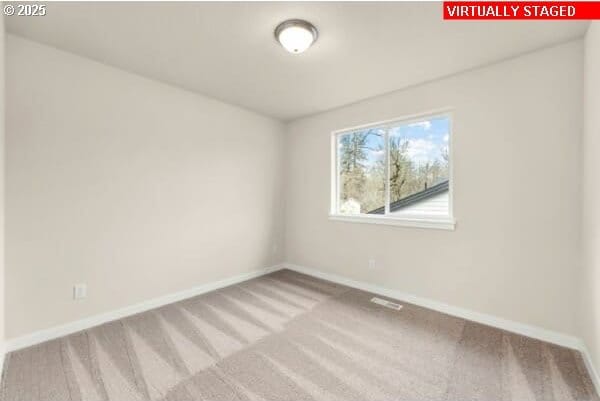 10587 SE Webelos Way, Happy Valley, OR 97086 - carpeted spare room with baseboards
