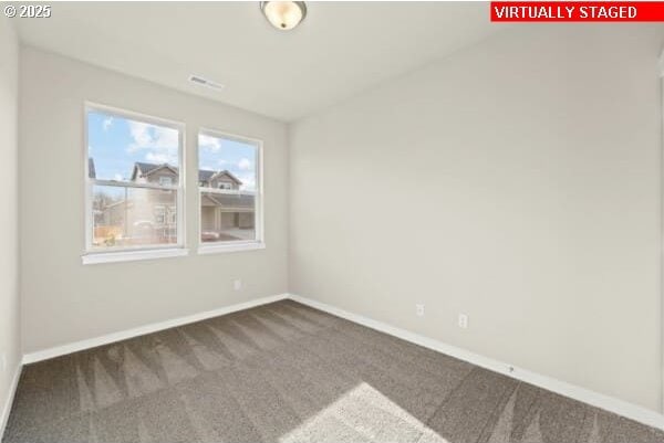 10587 SE Webelos Way, Happy Valley, OR 97086 - carpeted spare room with baseboards and vaulted ceiling