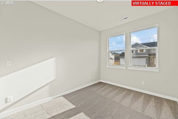 10587 SE Webelos Way, Happy Valley, OR 97086 - unfurnished room with carpet floors and baseboards