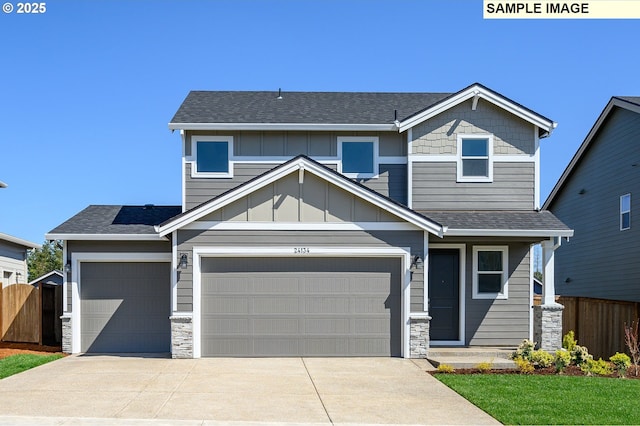 craftsman-style house with board and batten siding, fence, and stone siding