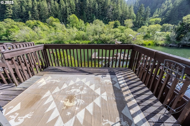 43605 State Highway 38 Unit 41, Reedsport, OR 97467 - wooden deck featuring a view of trees