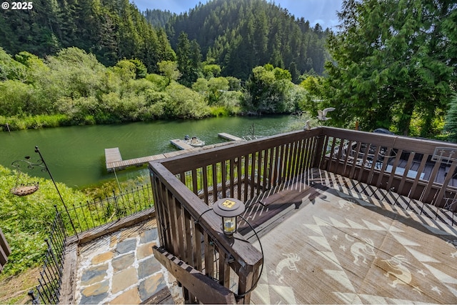 43605 State Highway 38 Unit 41, Reedsport, OR 97467 - deck with a wooded view, a water view, and a floating dock