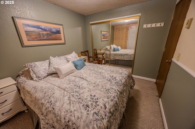 43605 State Highway 38 Unit 41, Reedsport, OR 97467 - carpeted bedroom featuring a closet, a textured ceiling, and a textured wall