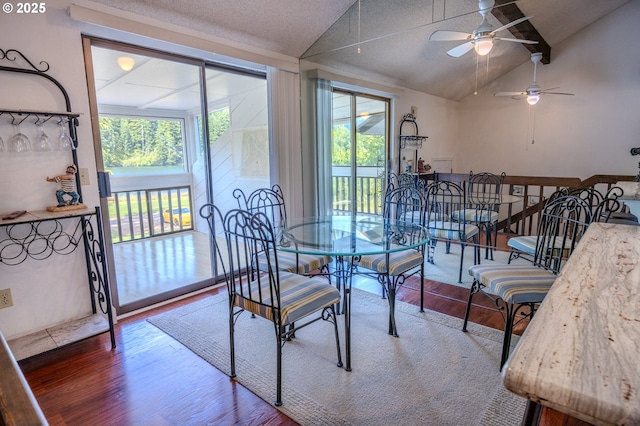43605 State Highway 38 Unit 41, Reedsport, OR 97467 - dining space with a ceiling fan, healthy amount of natural light, lofted ceiling, and wood finished floors