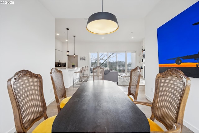 dining space featuring hardwood / wood-style flooring