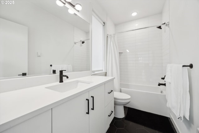 full bathroom with tile patterned floors, shower / tub combo with curtain, vanity, and toilet