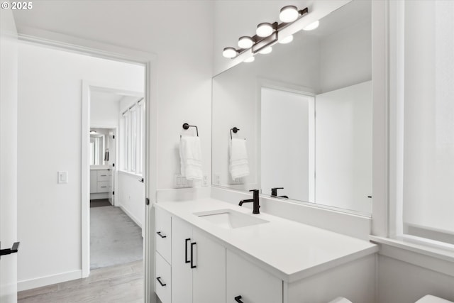 bathroom featuring vanity and hardwood / wood-style floors