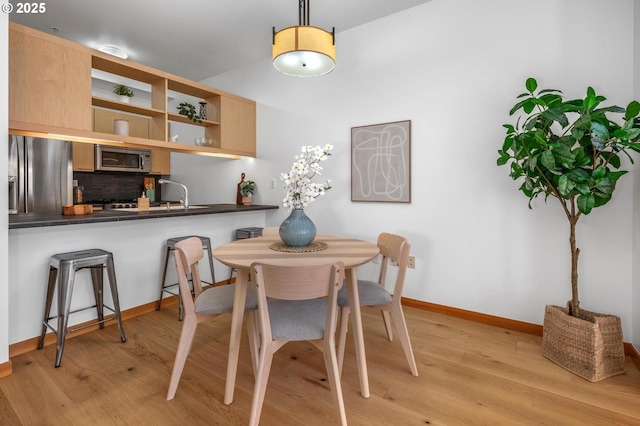 725 NW 10th Ave Unit 503, Portland, OR 97209 - dining space with light wood finished floors