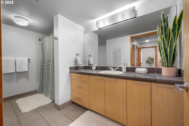 725 NW 10th Ave Unit 503, Portland, OR 97209 - bathroom with vanity, tile patterned flooring, and a shower with curtain