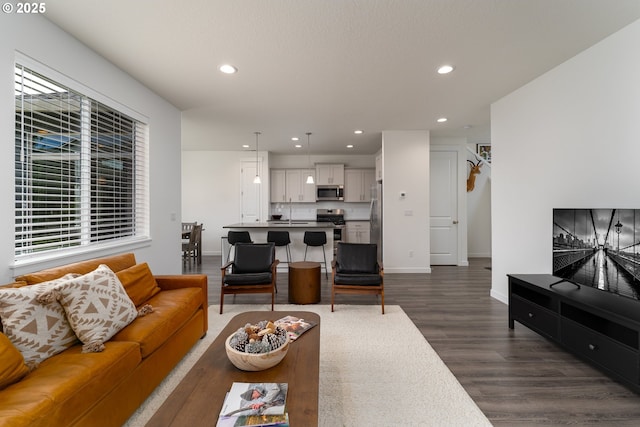 24200 SW Chestnut Ter, Sherwood, OR 97140 - living area with dark wood-style floors and recessed lighting