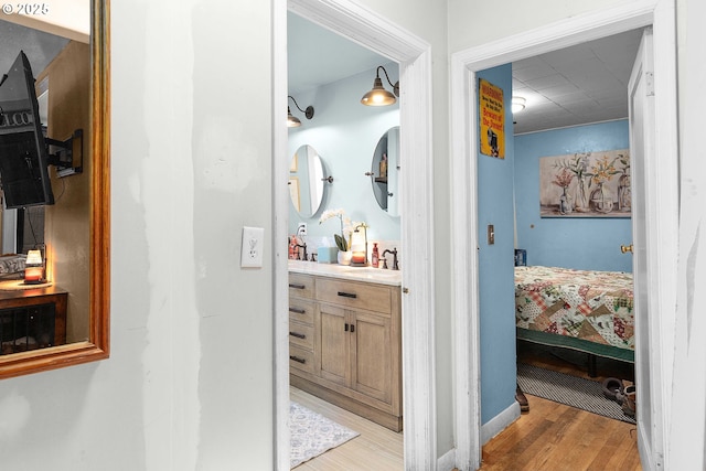 bathroom featuring vanity and hardwood / wood-style floors