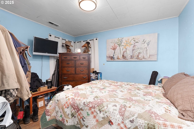 bedroom featuring hardwood / wood-style floors