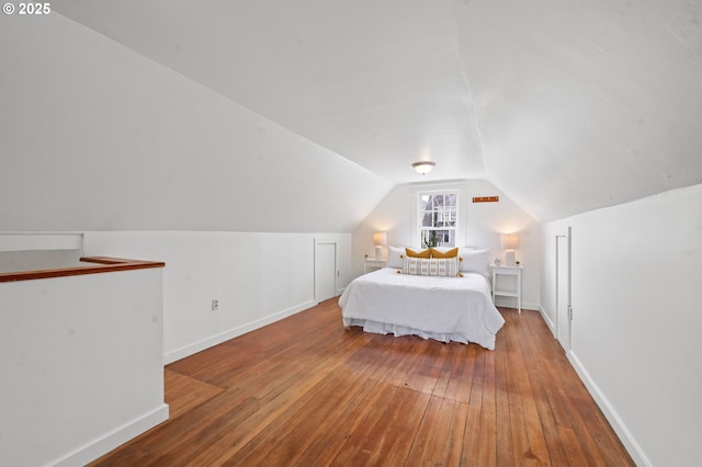 760 Jerome Ave, Astoria, OR 97103 - bedroom with wood-type flooring and vaulted ceiling