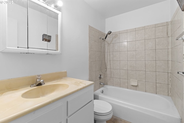 bathroom featuring shower / bath combination, vanity, and toilet