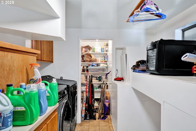 clothes washing area featuring independent washer and dryer