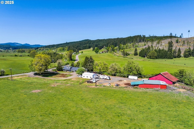 89353 Poodle Creek Rd, Noti, OR 97461 - view of parking with a view of trees, a carport, driveway, and an exterior structure