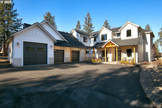 modern inspired farmhouse with a garage