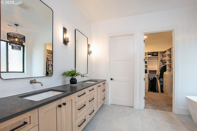 19550 Buck Canyon Rd, Bend, OR 97702 - bathroom with double vanity, a soaking tub, visible vents, and a sink